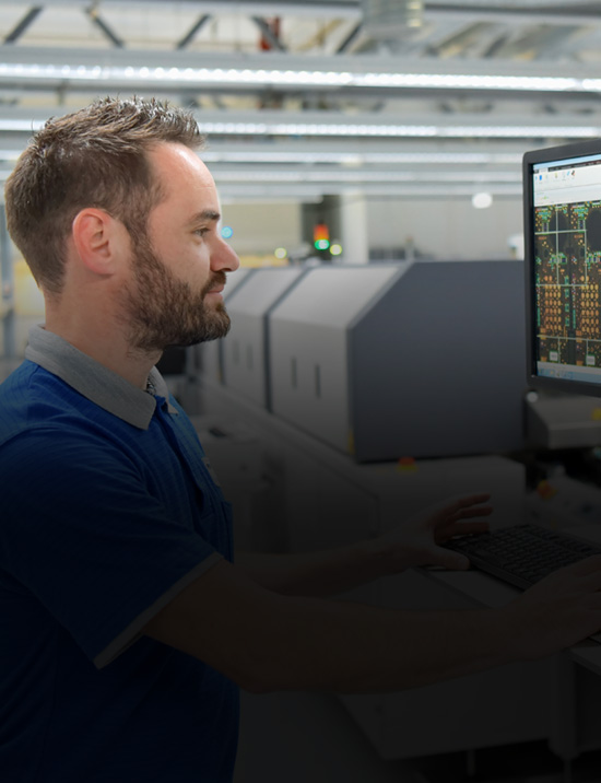 worker working on computer in a factory