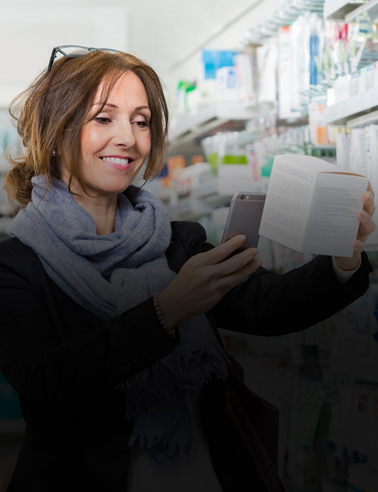 Lady scanning product with her phone in a retail setting
